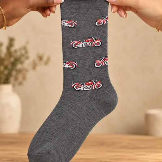 Grey socks with red motorcycles — held in hands